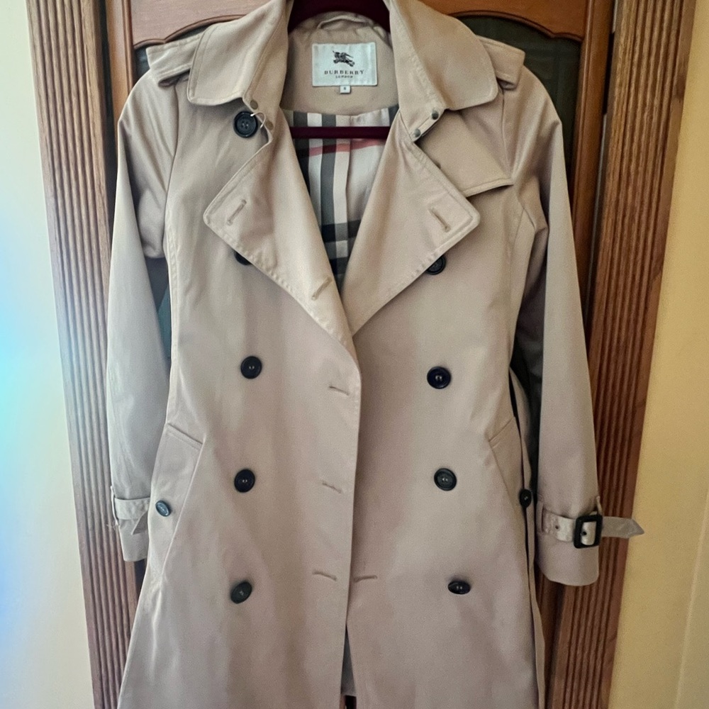 BURBERY woman's trench coat gently worn.  Beautiful style and color